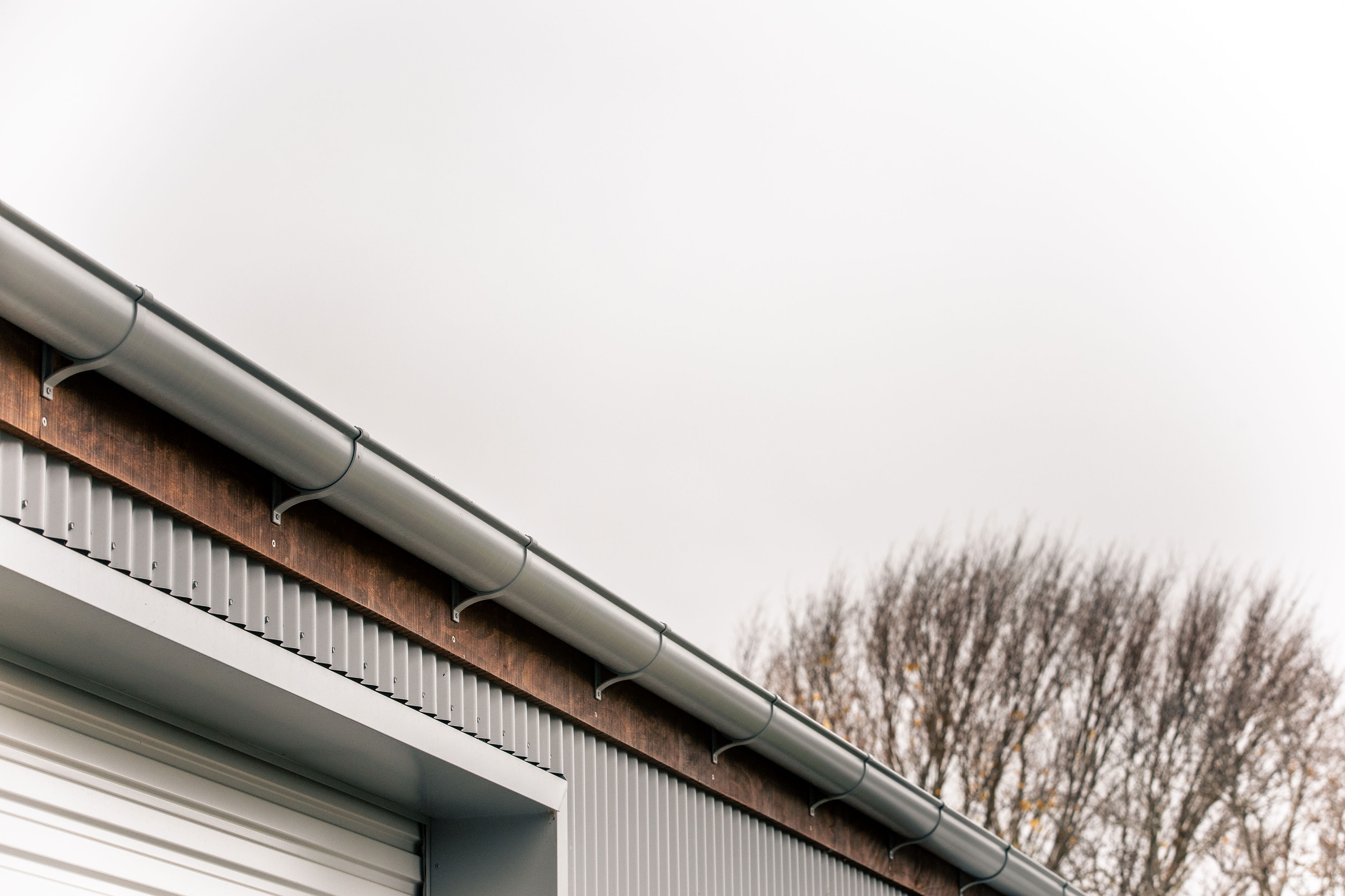 Half Round Gutter in Sandstone Grey with external brackets on a Lincoln property