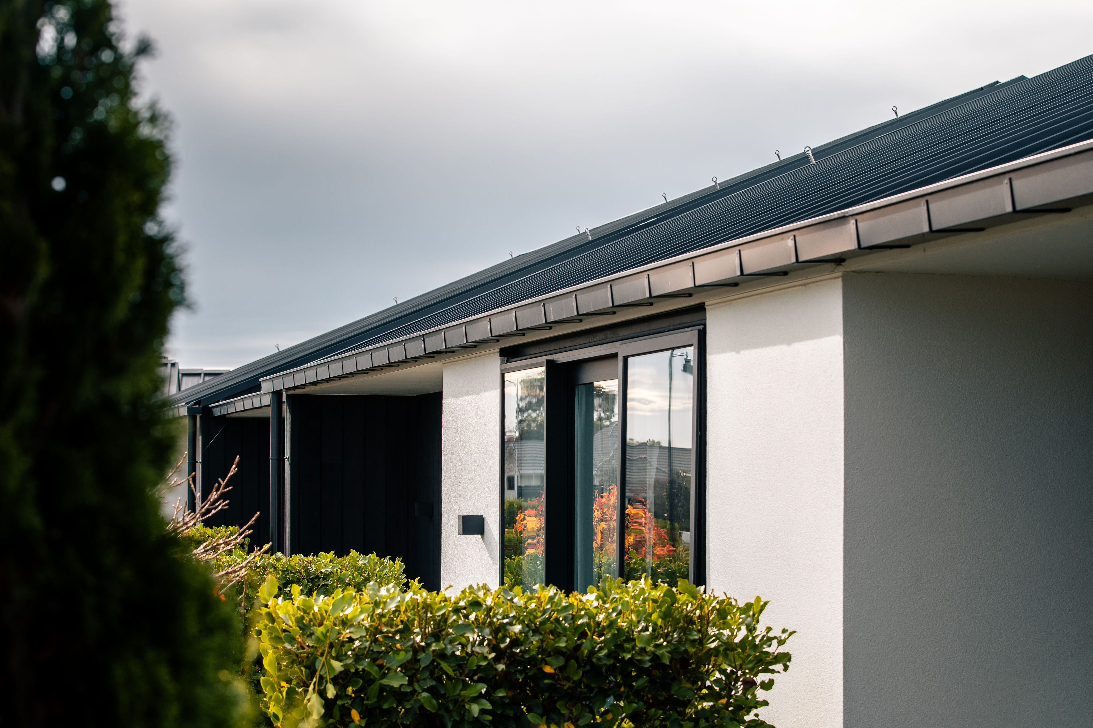 New continuous spouting being installed on a Christchurch home